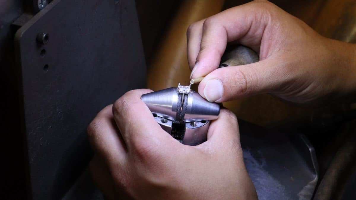 Goldsmith working on a ring model in the Harmony Jewels workshop